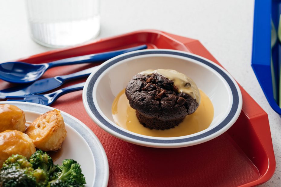 Chocolate Muffin with Custard ina White Bowl with Navy Blue Rim