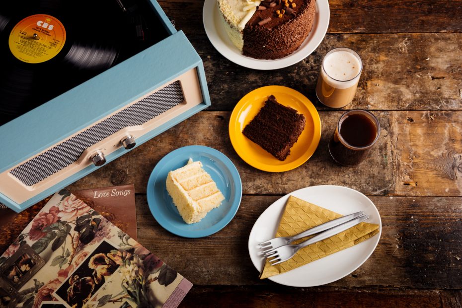 White Chocolate Sponge Cake on a Blue Plate with Late Coffee