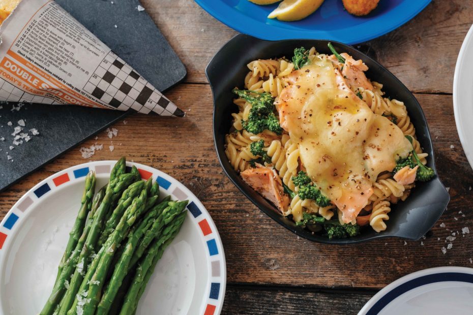 Pasta Bake with salmon in a black individual portion dish