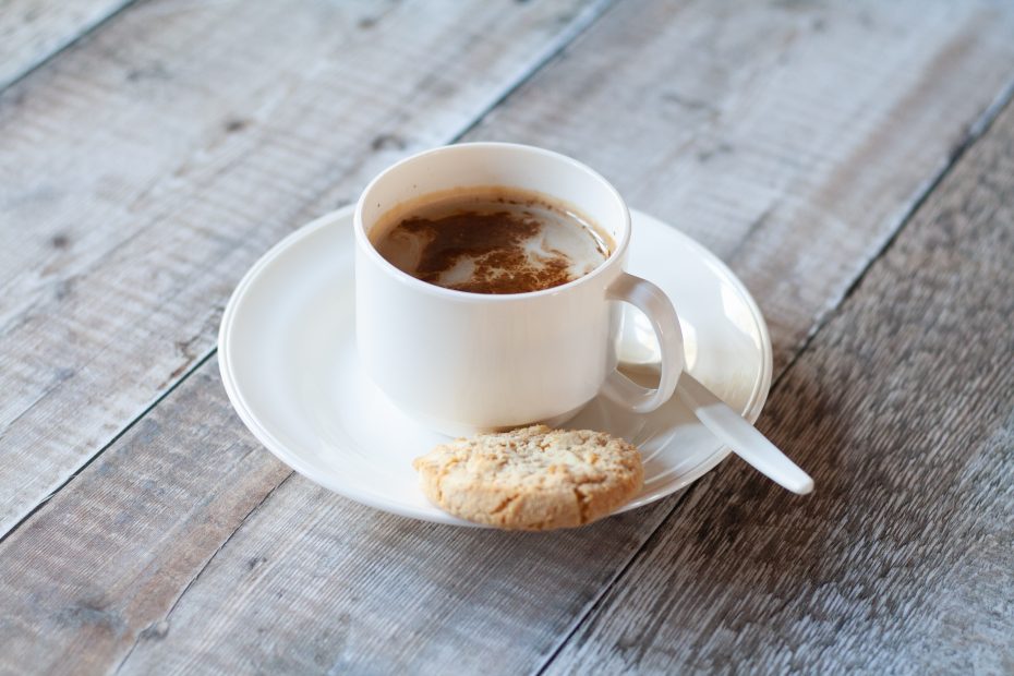 White Cup with Handle and Saucer with Coffee and Biscuit