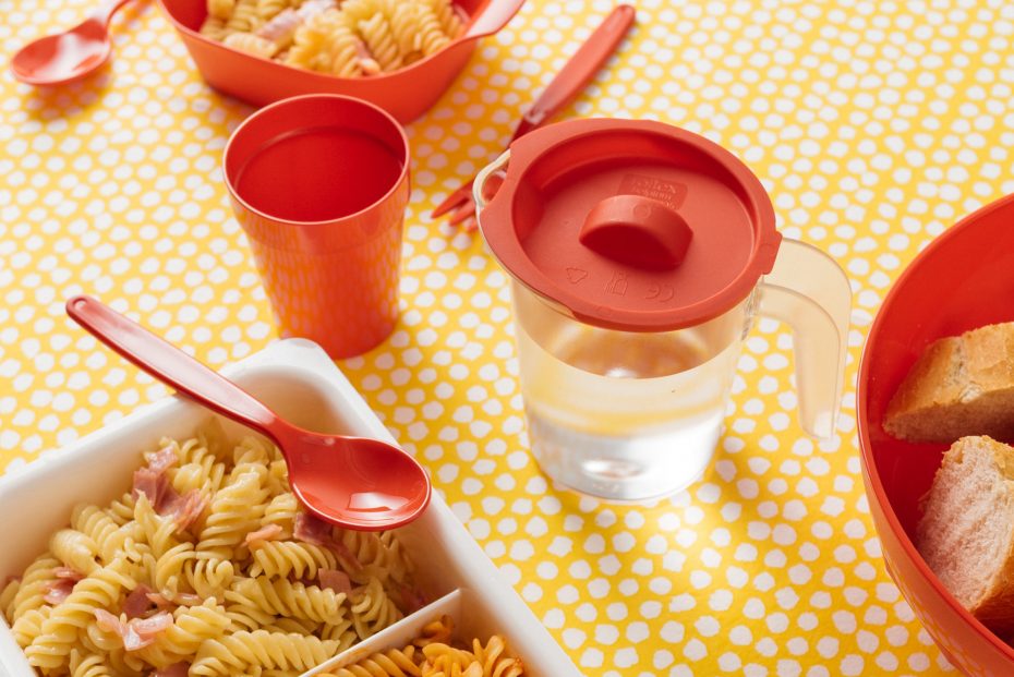 Small Frosted Jug with Red Lid at a Nursery Table