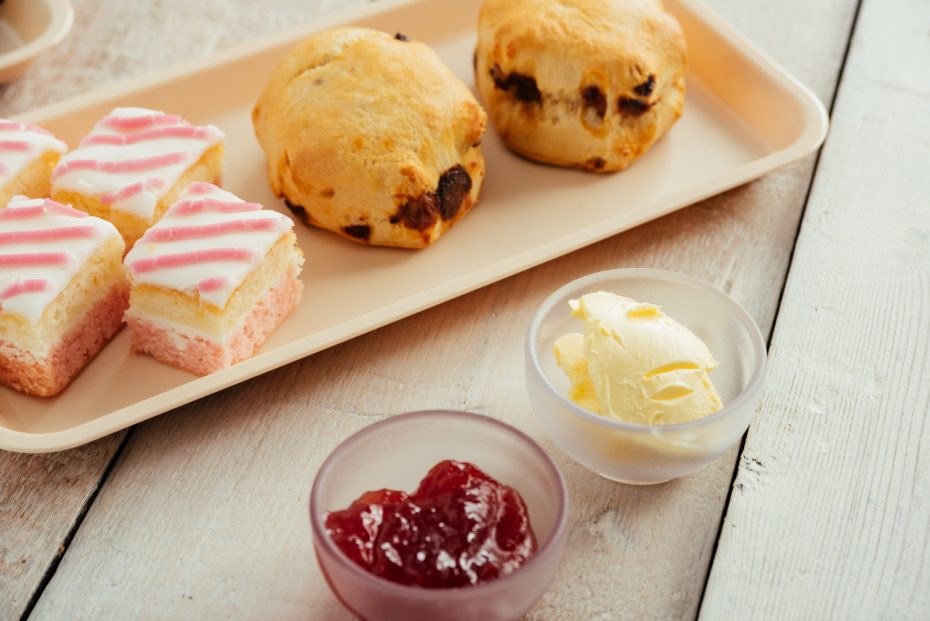 Afternoon tea on a platter with condiment bowls