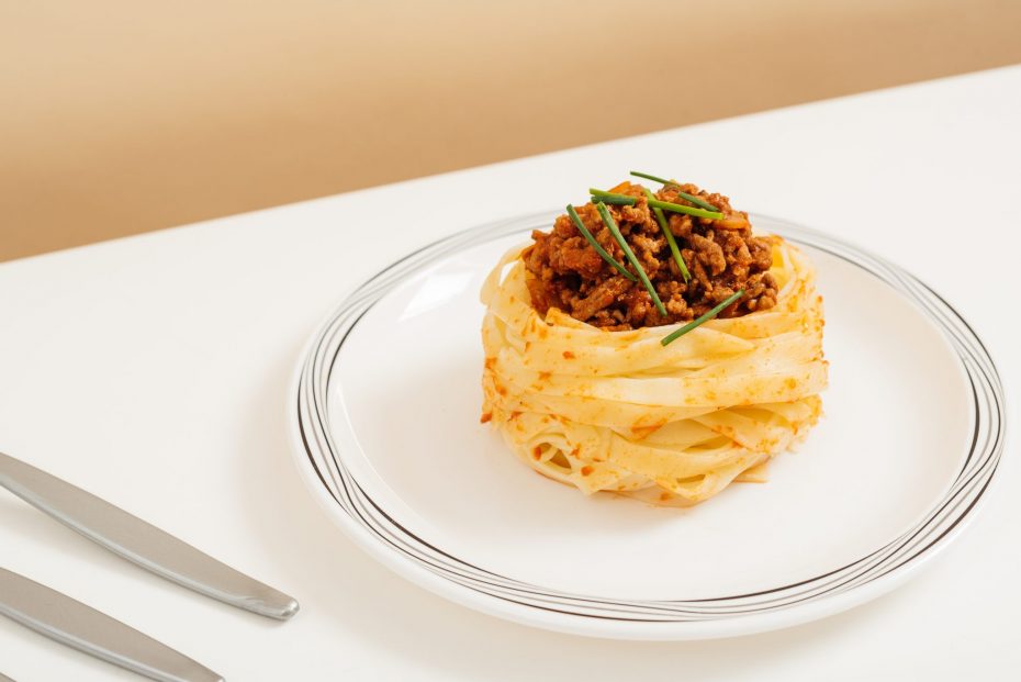 Spaghetti Bolognese on a Black & Grey Swirl Plate