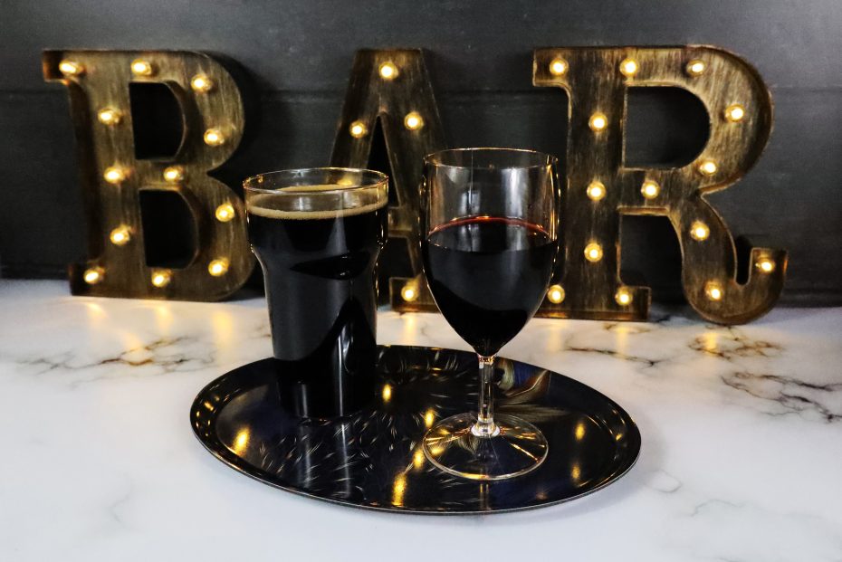 Stout Pint with Glass of Wine at Bar Setting