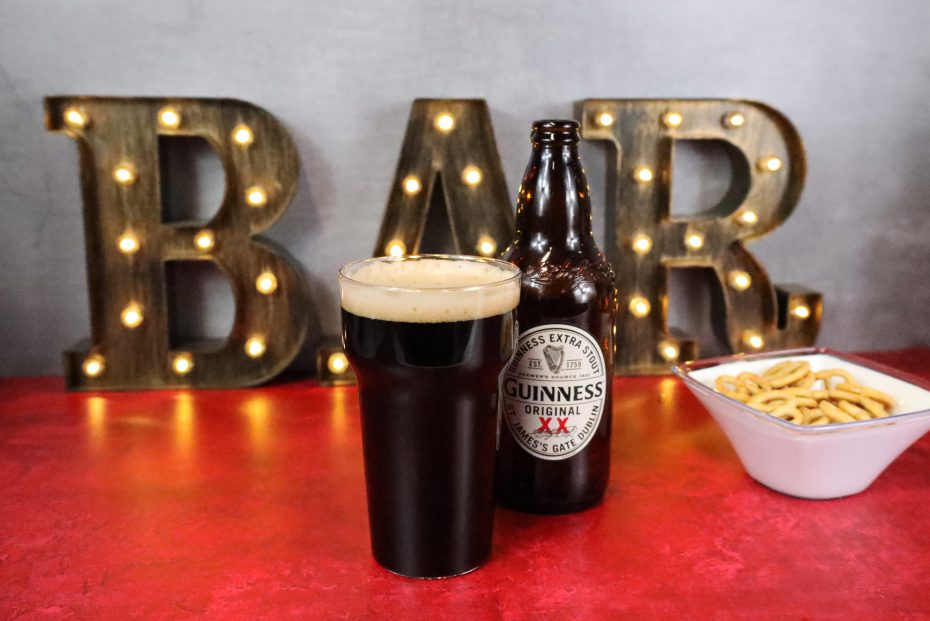 Guinness in a Pint Tumbler with Snacks