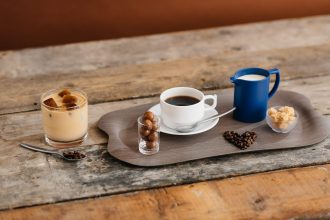 Coffee and Milk Jug on a Grey Wood Tray