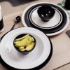 White and Black Coffee Cup on a Table