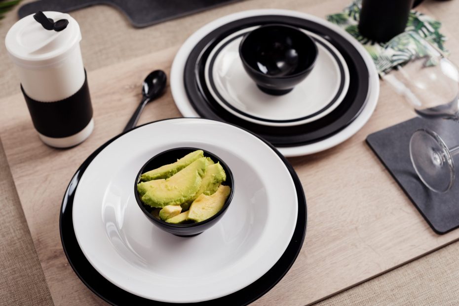 White and Black Coffee Cup on a Table