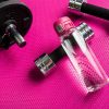 Water Bottle with Pink Sports Cap at a Gym