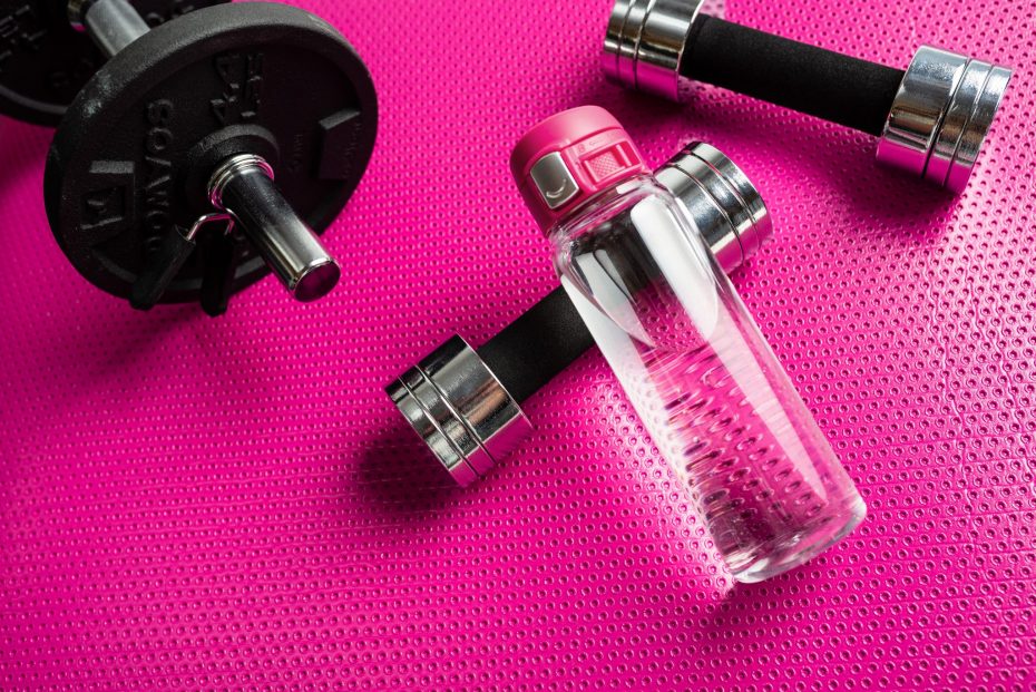 Water Bottle with Pink Sports Cap at a Gym