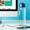 Water Bottle with Blue Sports Cap at a Computer Desk