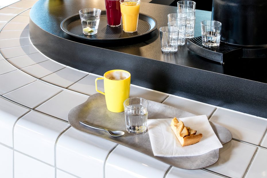 Yellow Beaker with Handle in a Cafe