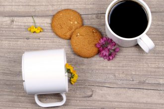 Black Coffee in a White Mug with Biscuits