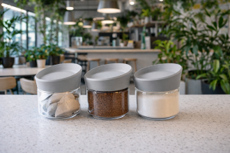 Medium Jars with Coffee, Tea and Sugar in a Canteen Setting
