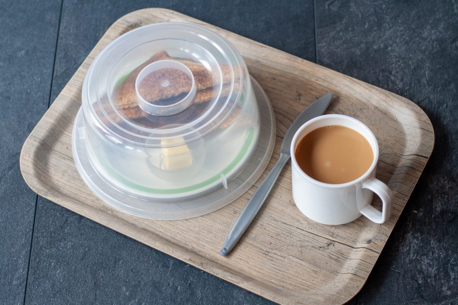 Toast on small plate with high cloche